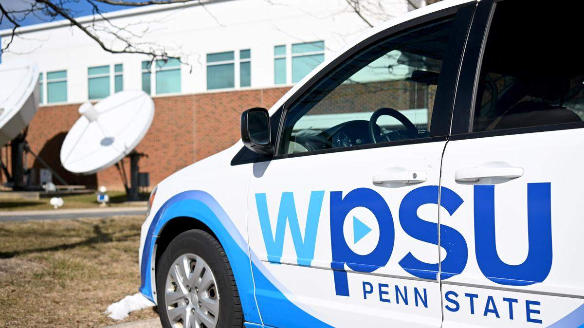 A WPSU van and the broadcast satellites are pictured outside of 100 Innovation Boulevard.  
