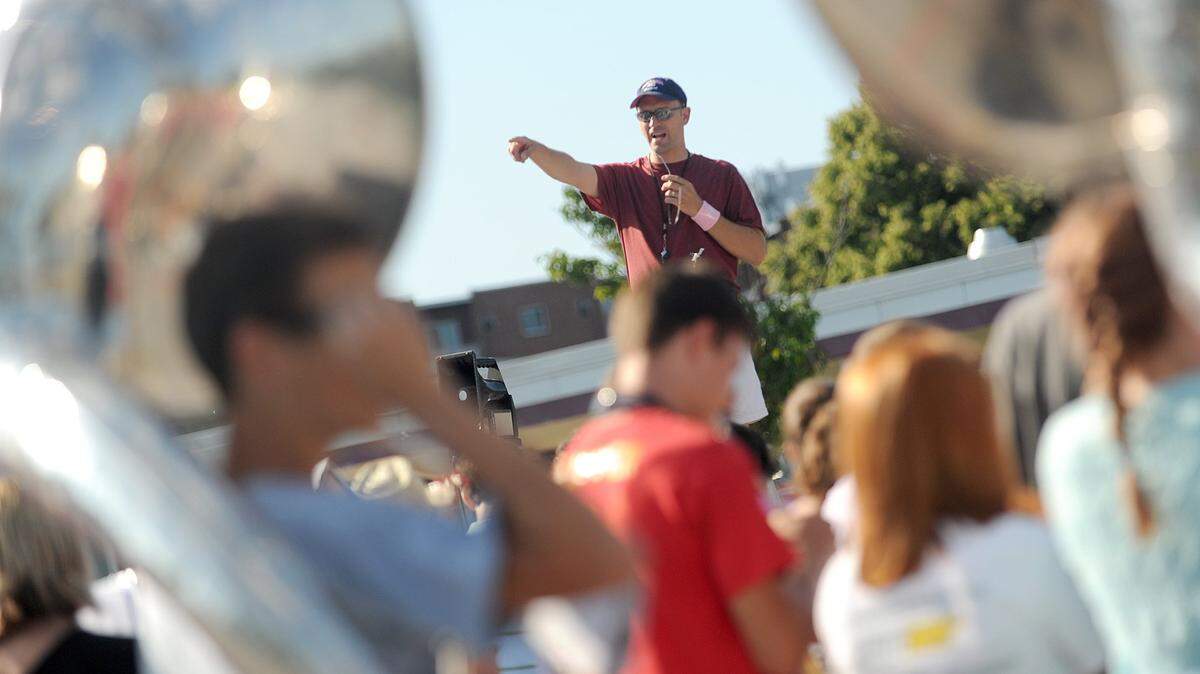 State College Area High School band director Paul Leskowicz directs the marching band during a practice at the south parking lot in 2011.