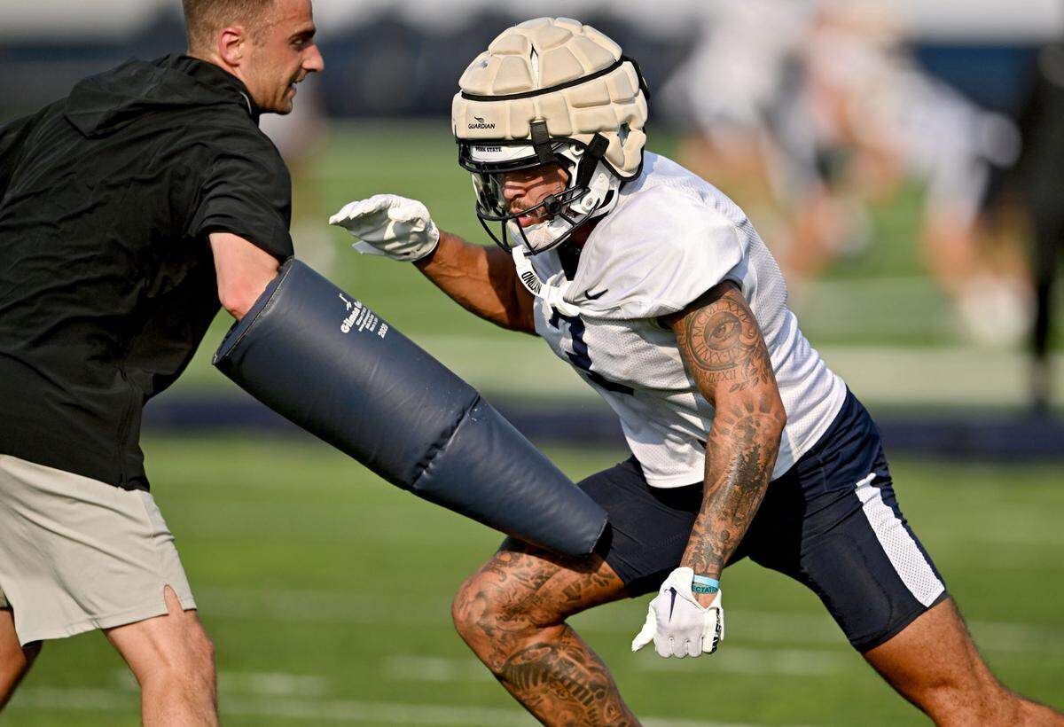 Penn State wide receiver Julian Fleming runs a drill at practice on Wednesday, July 31, 2024.