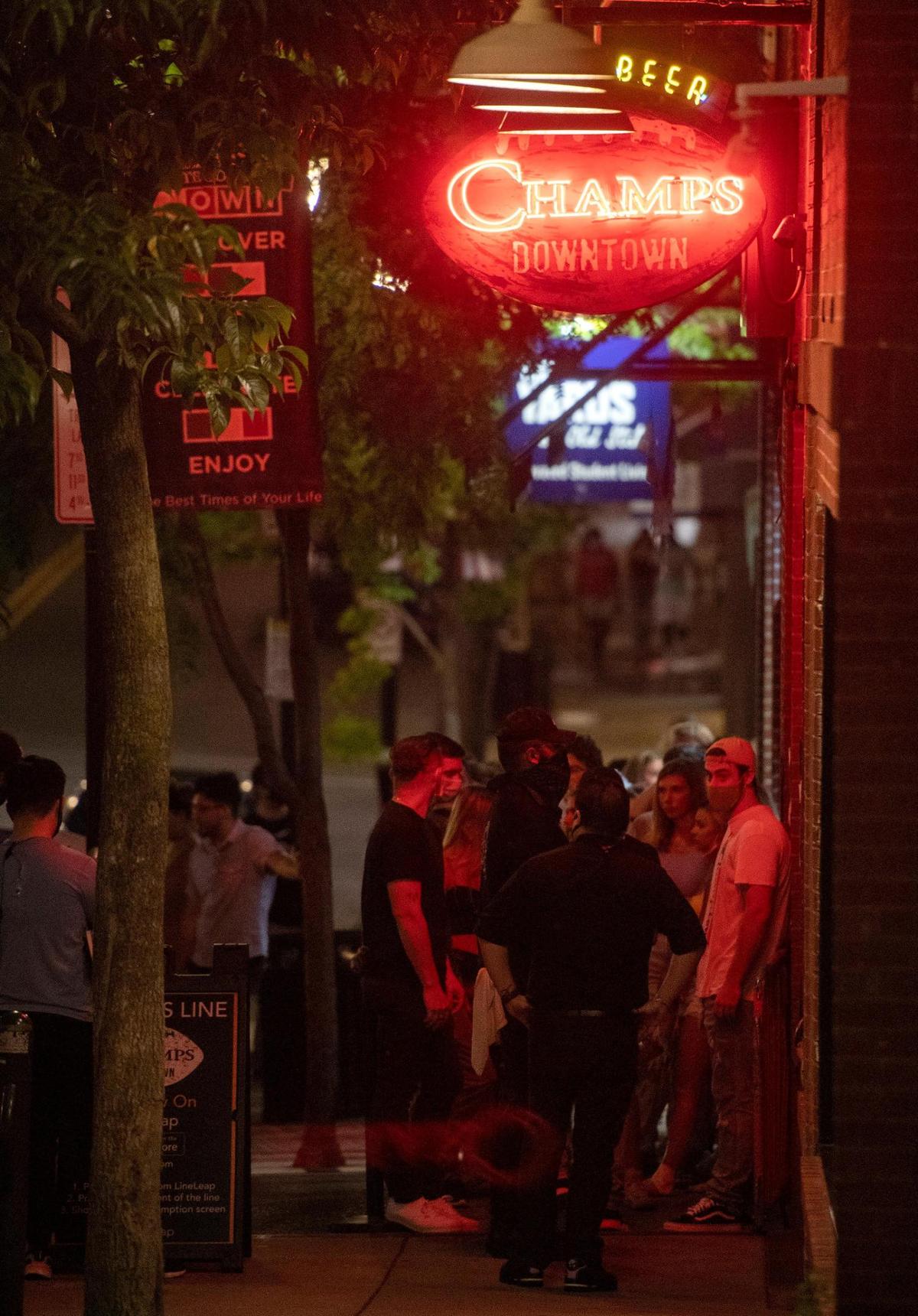 Patrons line up outside of Champs in downtown State College waiting to get in on Saturday, July 11, 2020.