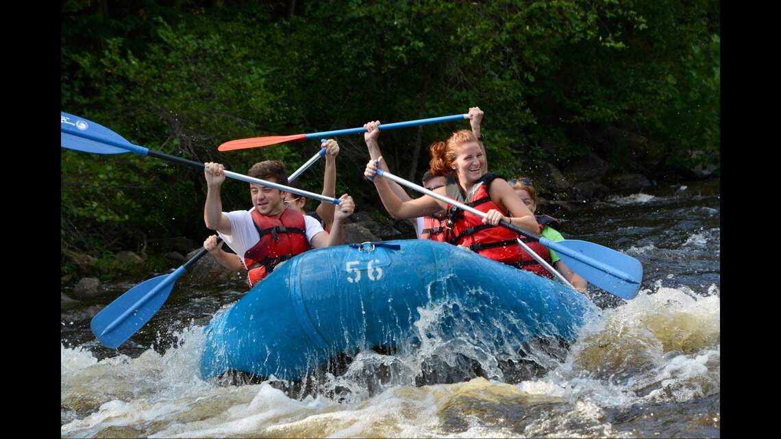PA Rafting enthusiasts navigating Class III rapids on the Lehigh River in Jim Thorpe