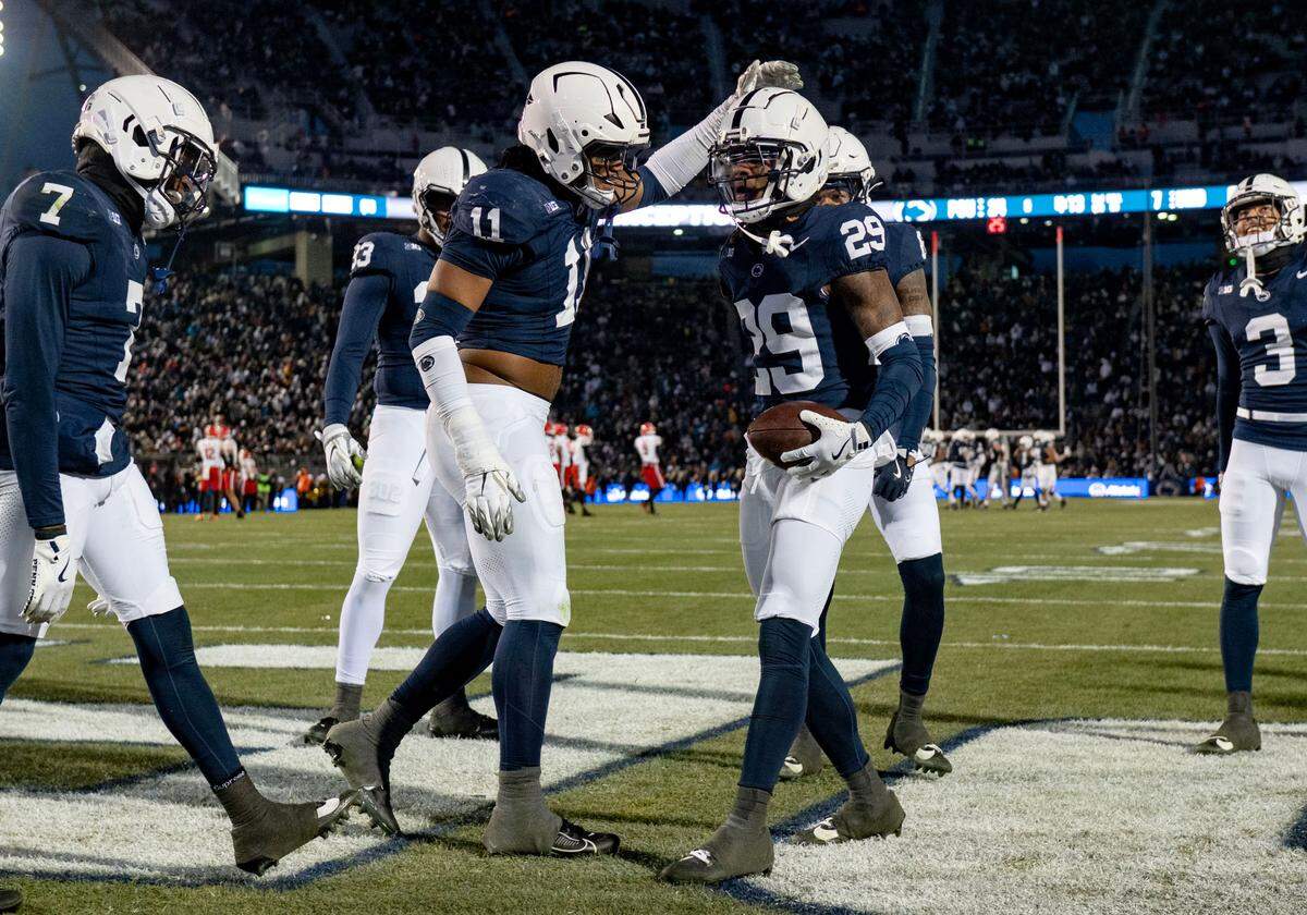 Penn State players Abdul Carter and Audavion Collins celebrate during the game against Maryland on Saturday, Nov. 30, 2024.