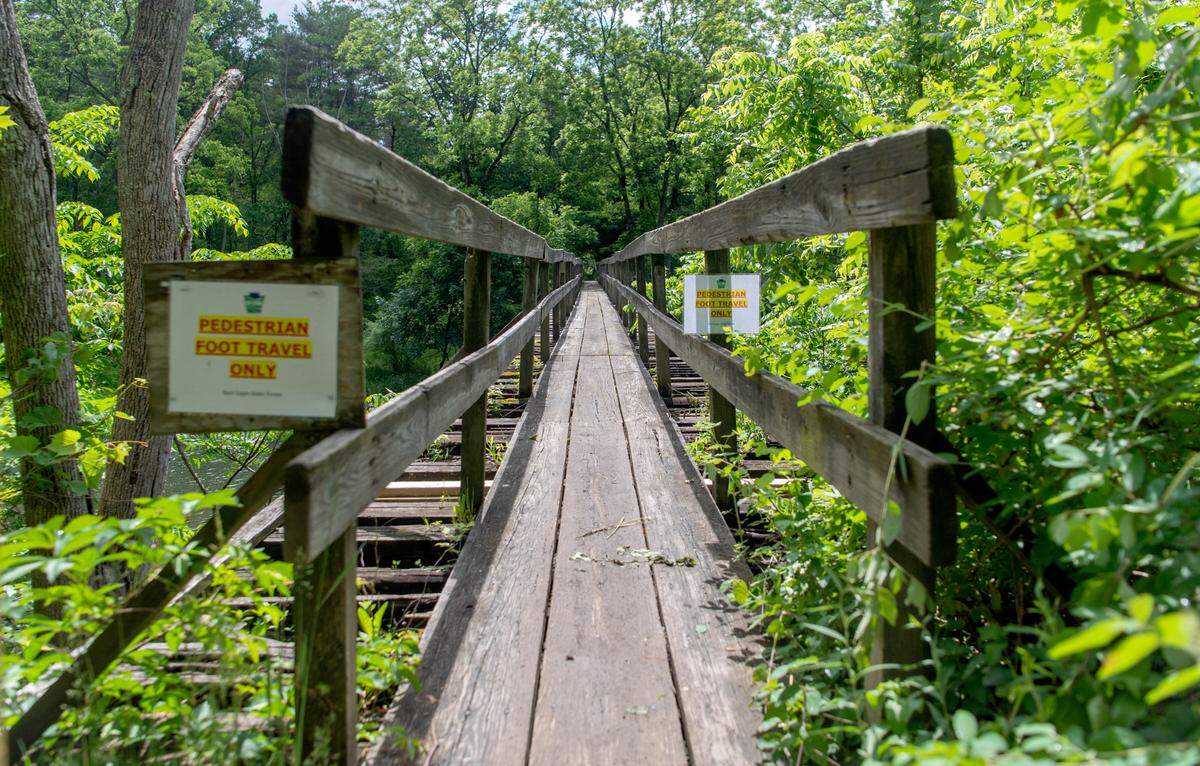 The foot bridge that goes over Penns Creek off of Tunnel Road in Coburn, often referred to as Fisherman’s Path, is in need of repairs. On Thursday, June 9, 2022 members of the Department of Conservation and Natural Resources met at the bridge to talk about financial needs.
