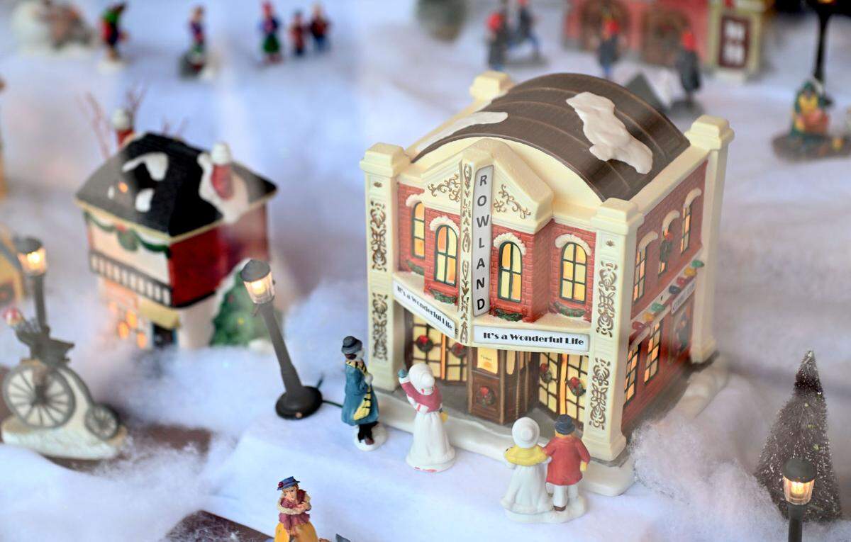 The window display at the Philipsburg Revitalization Corporation office features a miniature Rowland Theatre. Storefronts along North Front Street are decorated for Philipsburg’s Mid-Century Christmas.