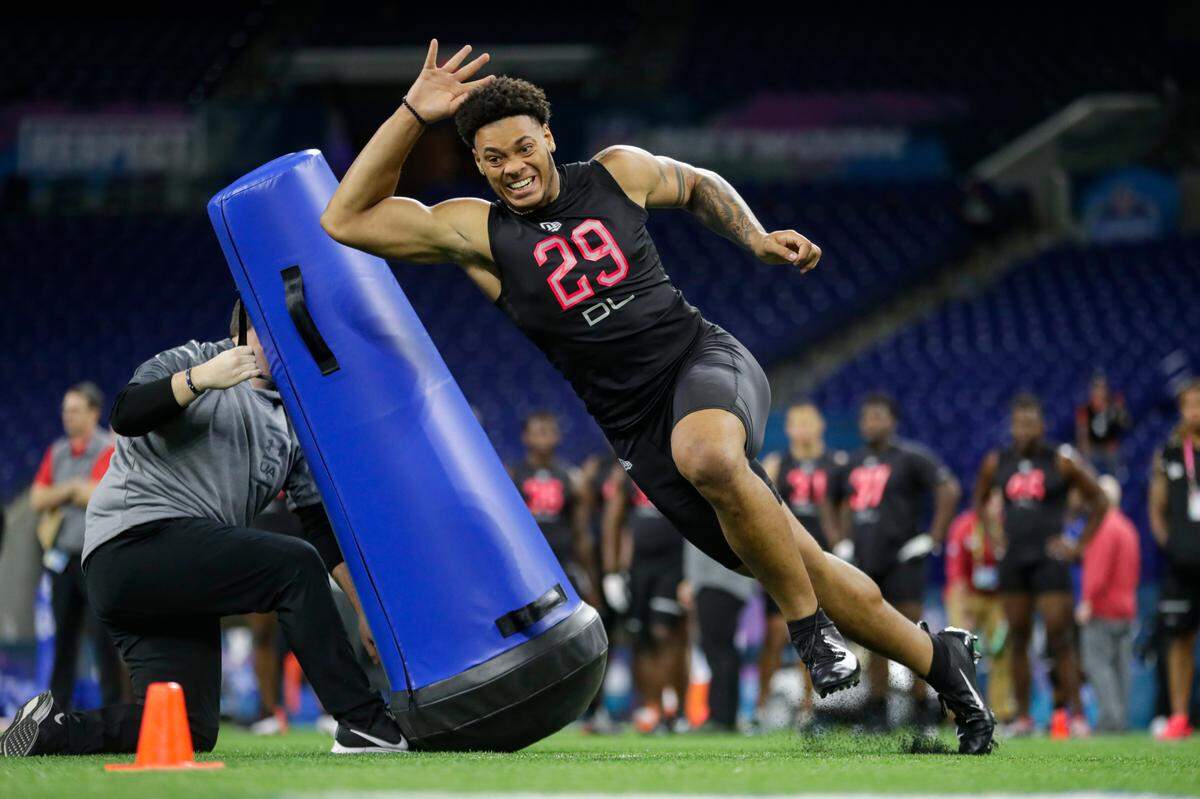 Penn State defensive lineman Yetur Gross-Matos runs a drill at the NFL football scouting combine in Indianapolis, Saturday, Feb. 29, 2020. (AP Photo/Michael Conroy)