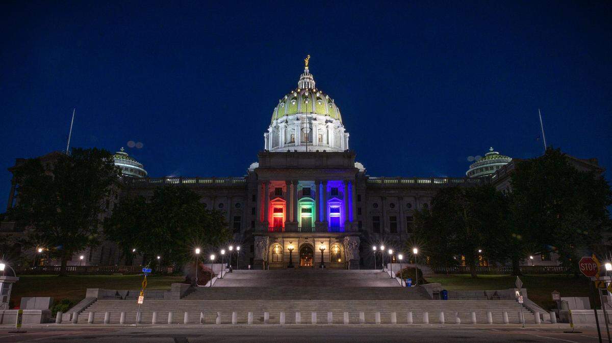 LGBTQ pride colors are displayed on the state Capitol in Harrisburg.
