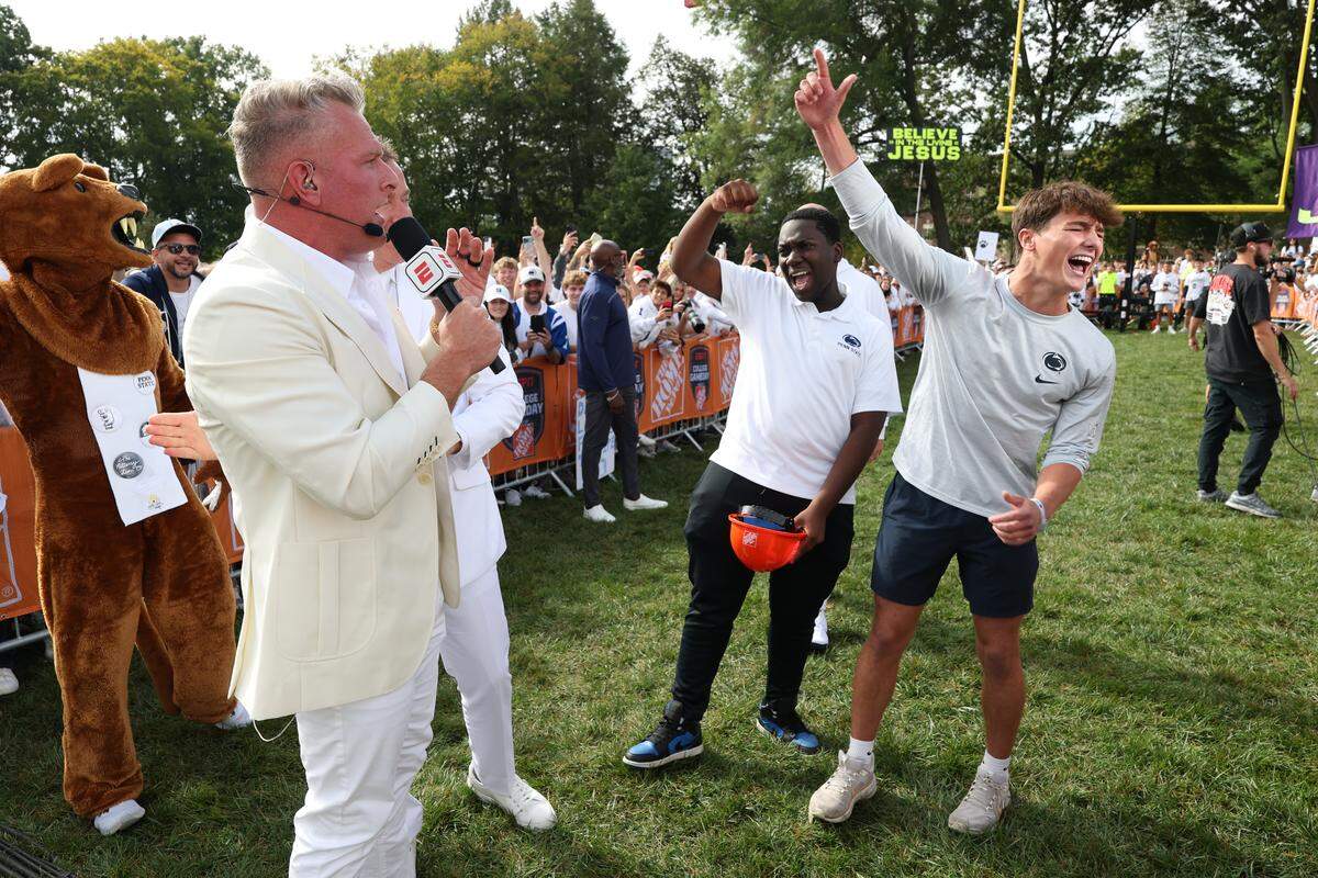 Penn State student Carson Albright, right, and fellow student William react Saturday morning during the Field Goal Kicking Challenge segment on the set of College GameDay at Penn State.