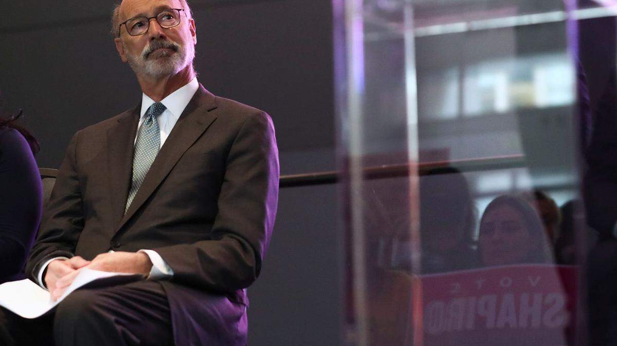 Pennsylvania Gov. Tom Wolf, seen here at a rally for his successor, Attorney General Josh Shapiro, said he will second-guess himself until the day he dies on his COVID-19 policies.