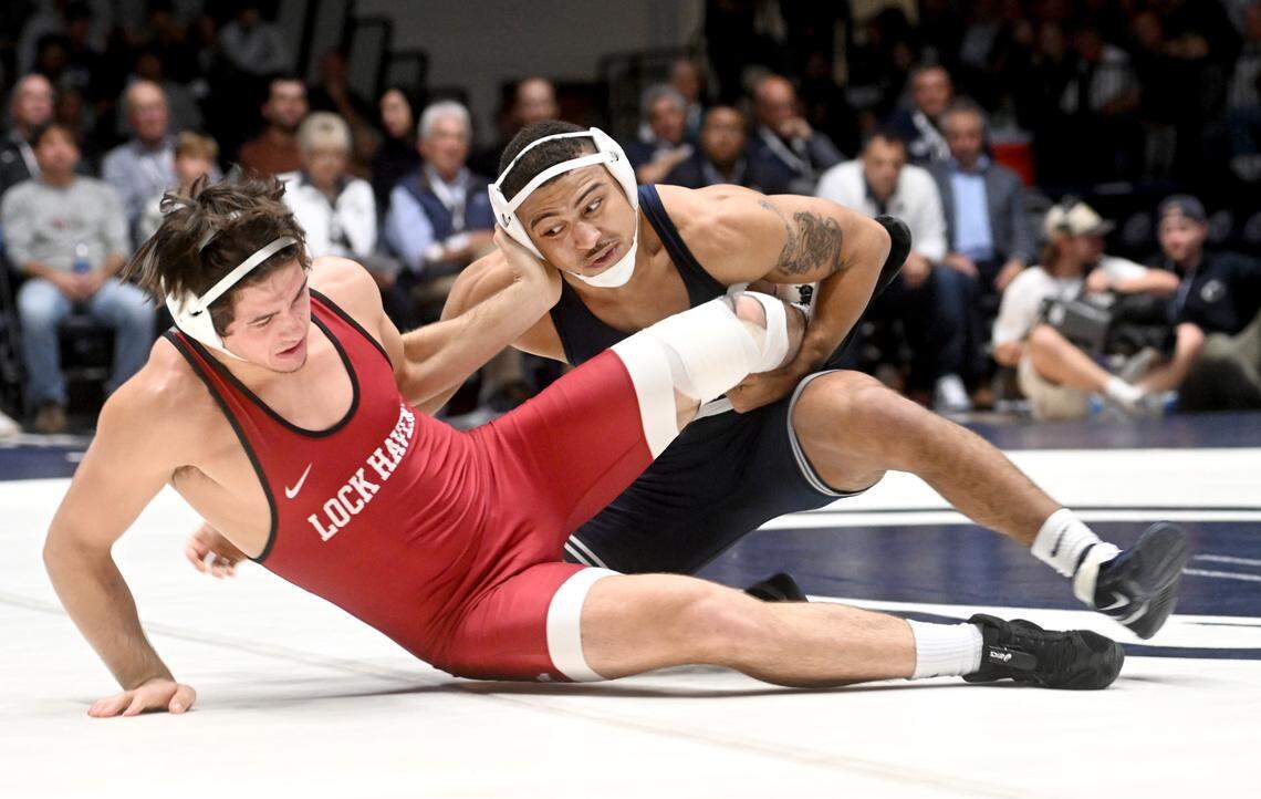 Lock Haven’s Colin Fegley tries to push off Penn State’s Aaron Brooks in the 184 lb bout of the match on Friday, Nov. 11, 2022.