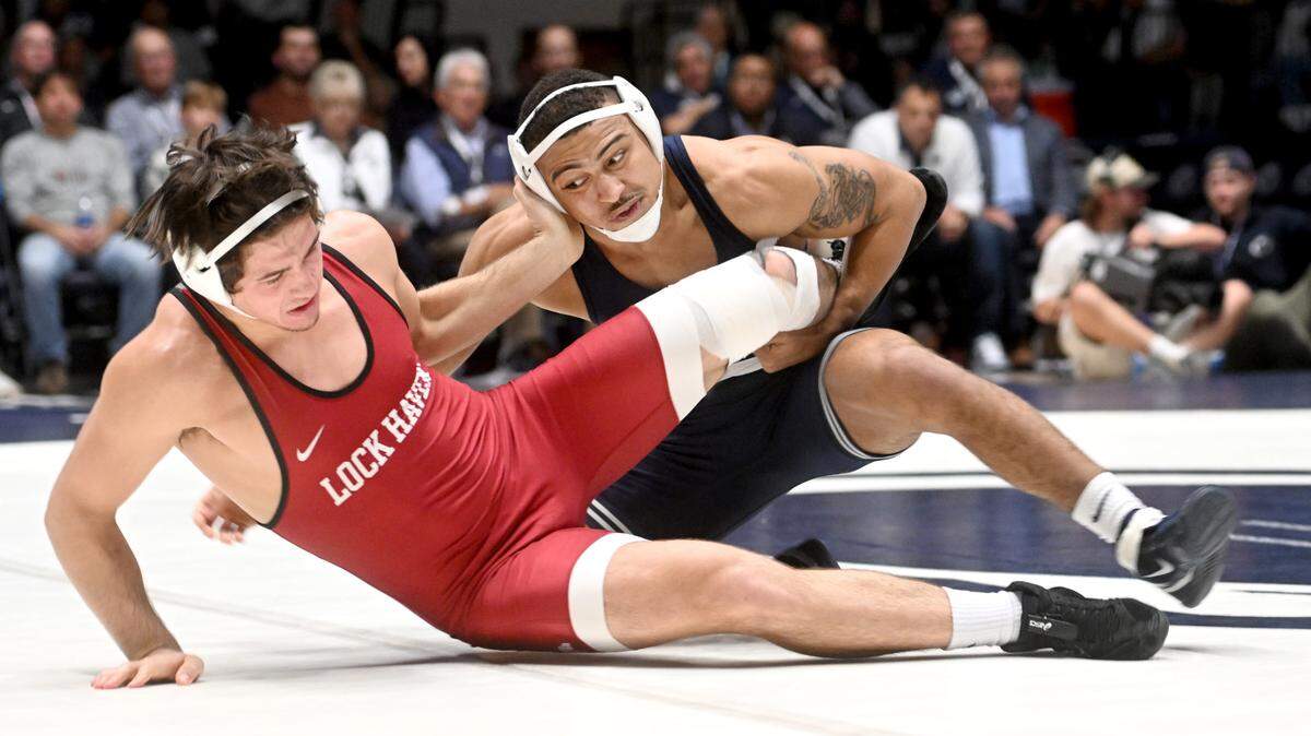 Lock Haven’s Colin Fegley tries to push off Penn State’s Aaron Brooks in the 184 lb bout of the match on Friday, Nov. 11, 2022.