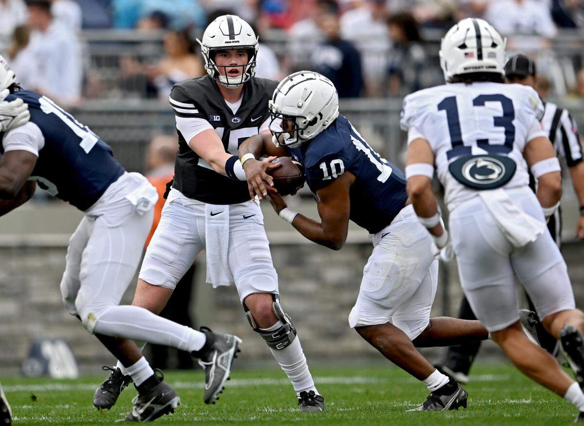 Quarterback Drew Allar hands off to running back Nick Singleton during the Penn State Blue-White game on Saturday, April 15, 2023.
