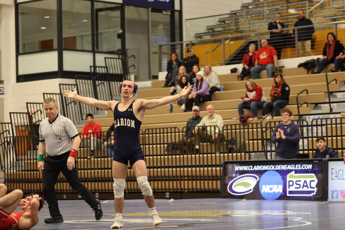 Clarion and former Bald Eagle Area wrestler Seth Koleno celebrates pinning Edinboro and former St. Joseph’s Catholic Academy wrestler Amonn Ohl on Jan. 27. Koleno leads the Golden Eagles into Rec Hall on Sunday to take on No. 1 Penn State.
