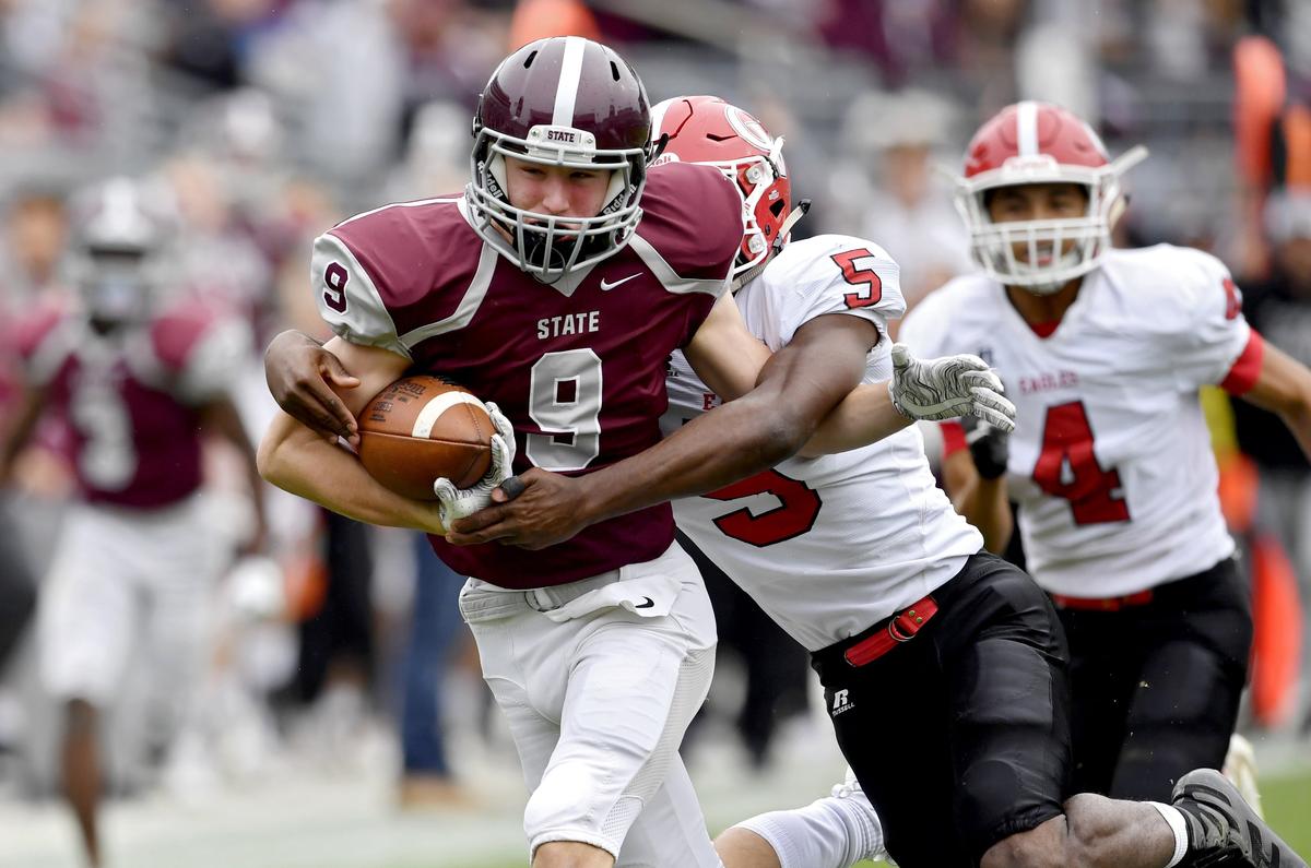 Cumberland Valley’s Gabriel Hayes tries to pull down State College’s Conrad Moore during the Beaver Stadium Classic on Saturday, Oct. 26, 2019.