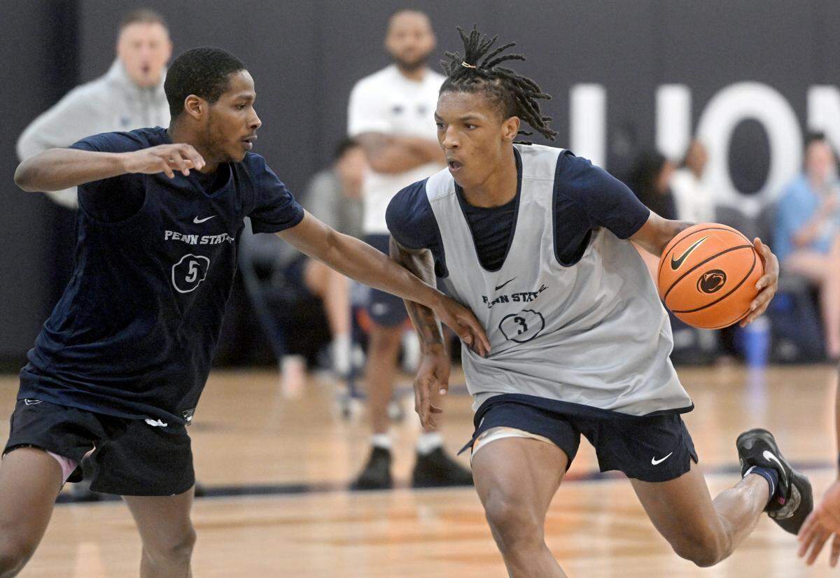 Penn State’s Nick Kern Jr. dribbles around Jameel Brown during a men’s basketball summer workout on Tuesday, July 11, 2023.