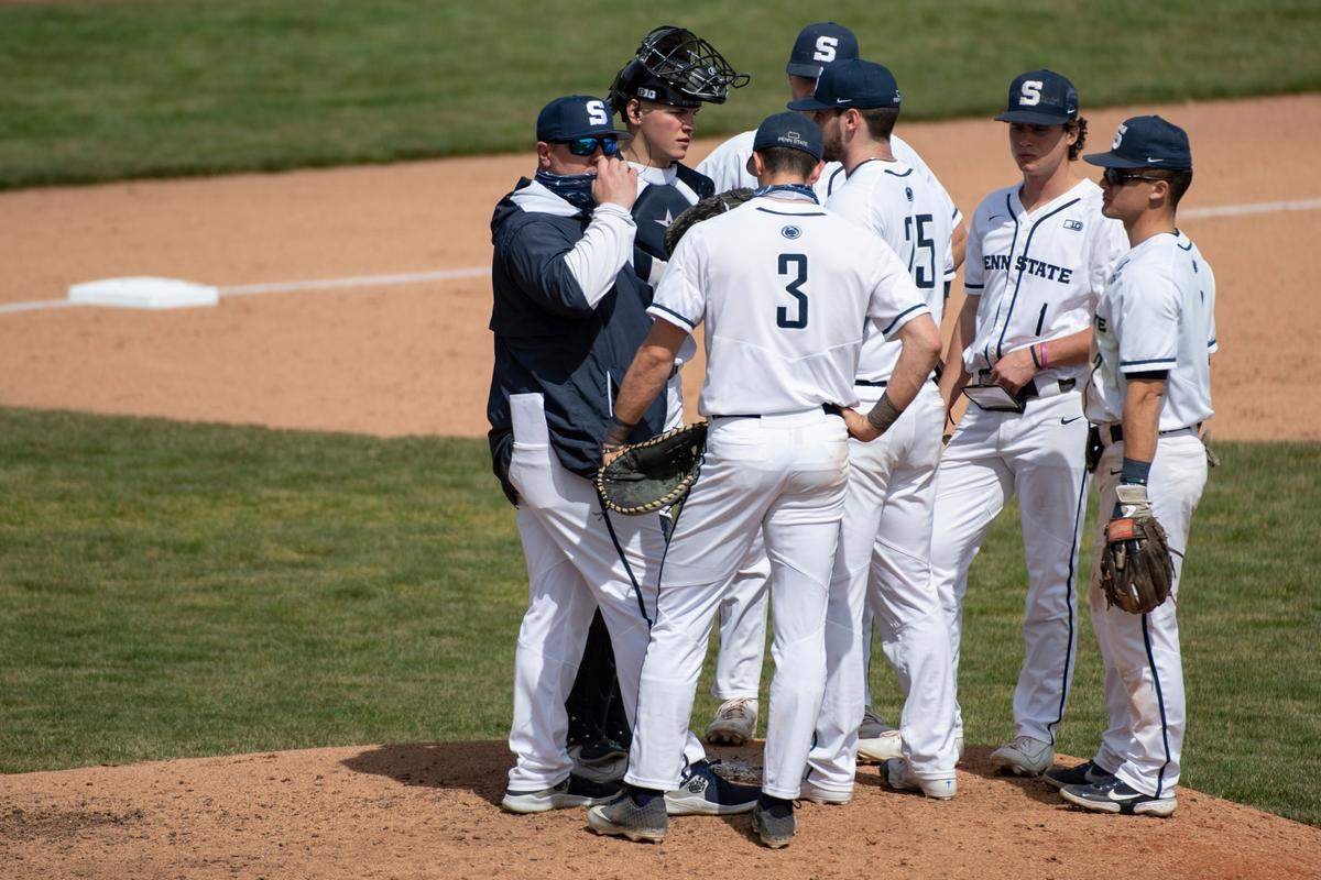 Penn State Head Coach Rob Cooper speaks with Penn State pitcher Conor Larkin (25) during Penn State Baseball’s game against Michigan at Medlar Field on Saturday, March 27, 2021.
