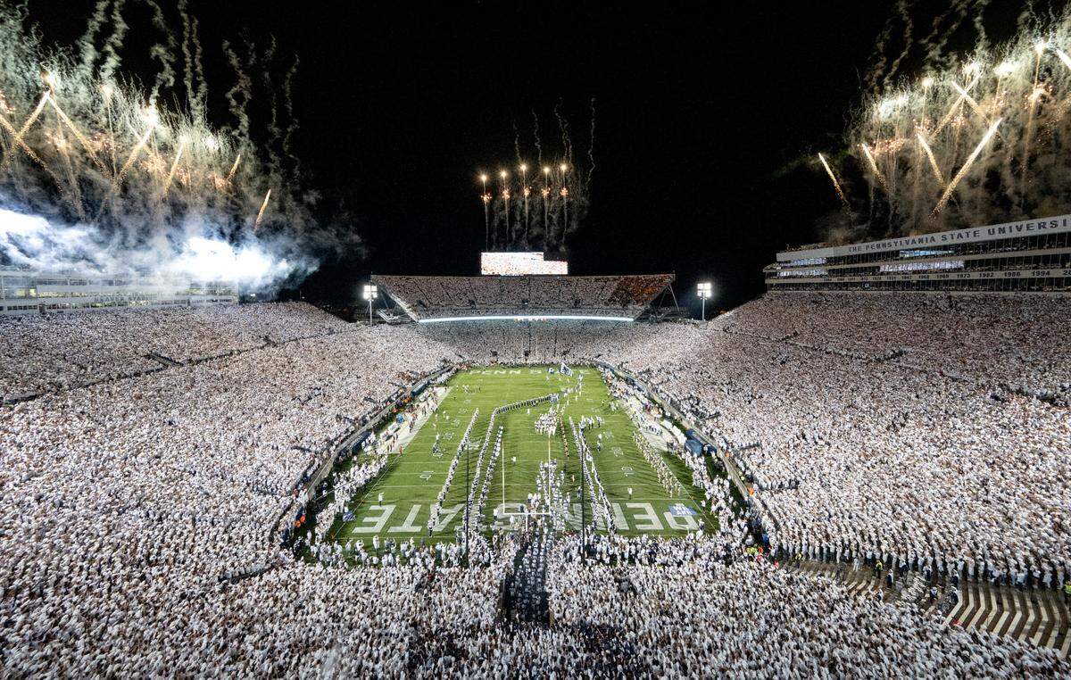 The Penn State football team runs onto the field for the White Out game against Minnesota on Saturday, Oct. 22, 2022 at Beaver Stadium.