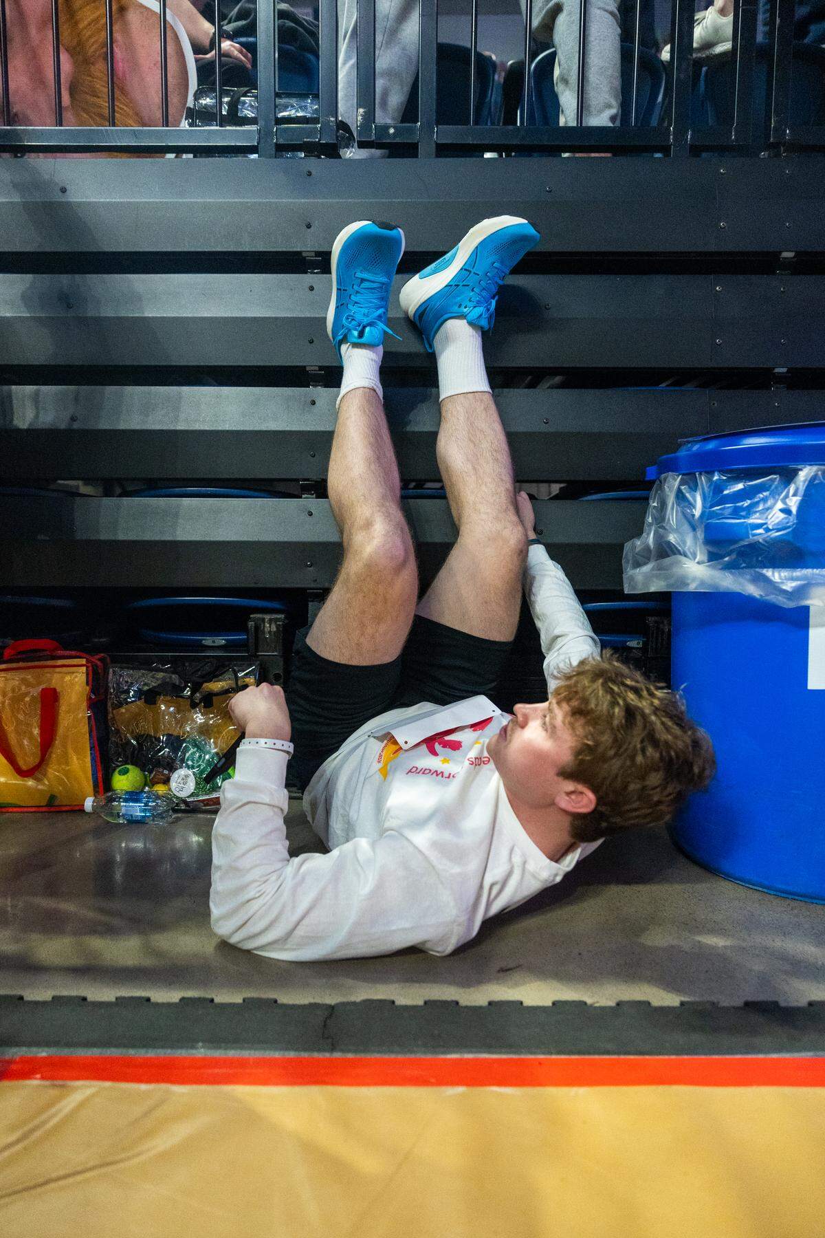 Dancer Daniel Heller, a senior studying mechanical engineering, keeps his legs up before standing up for Thon on Friday, Feb. 20, 2026 in the Bryce Jordan Center.