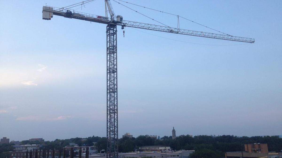 Crane operators, like the one in this crane working above the Fraser Centre in State College, scale the massive rig, which can take about 15 minutes, before beginning the 10-hour workday. 
