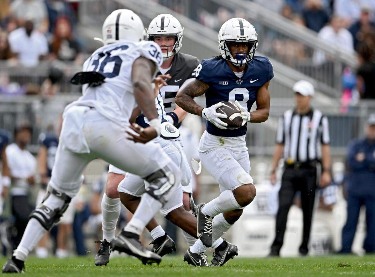 Wide receiver Tyler Johnson cuts down the field with the ball during the Penn State Blue-White game on Saturday, April 15, 2023.