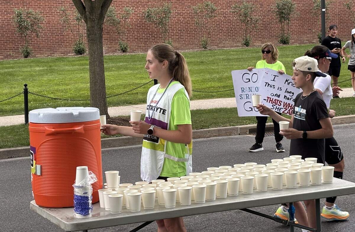 Volunteers ready refreshments on Curtin Road on Sunday, June 14, 2026, at the Ironman 70.3 Pennsylvania Happy Valley North American Championship in Centre and Clinton counties.