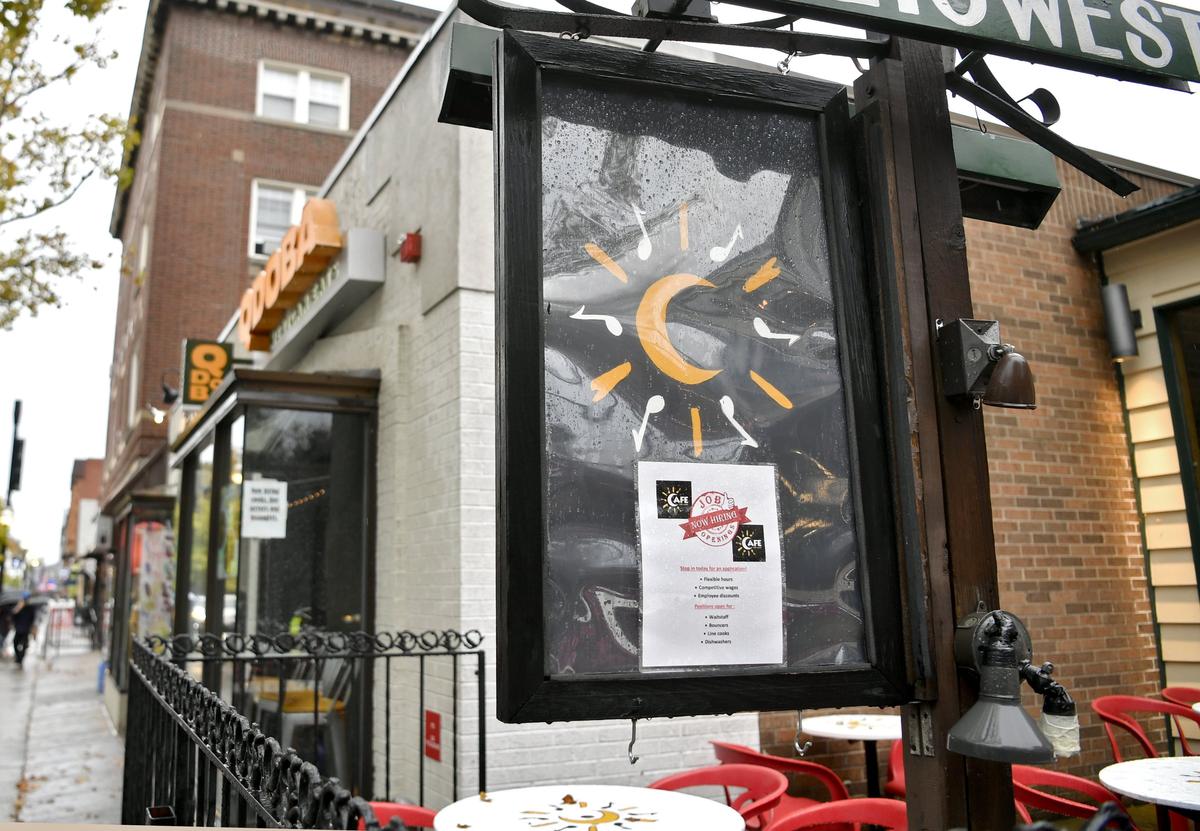 Many business in downtown State College, such as Cafe 210 West, have hiring signs posted.
