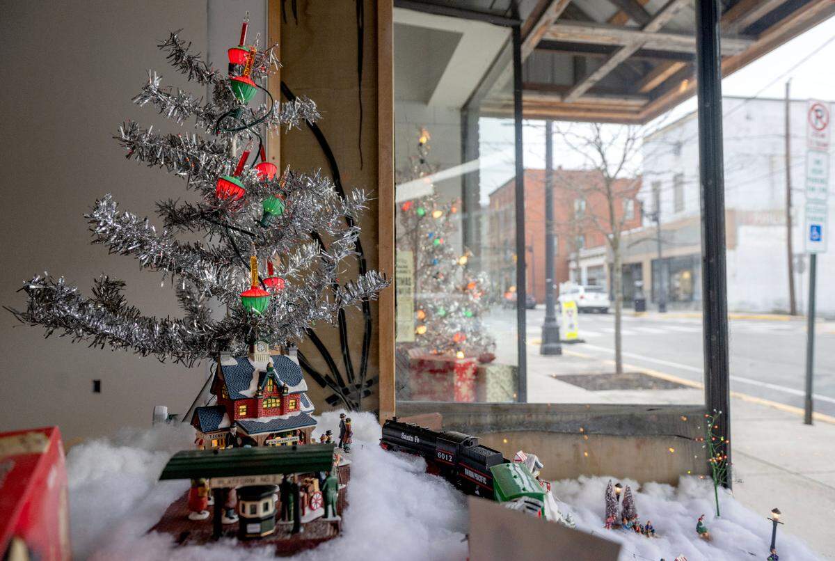 A tinsel tree and decorations in the window of the Philipsburg Revitalization Corporation office as they prepare for Philipsburg’s Mid-Century Christmas.
