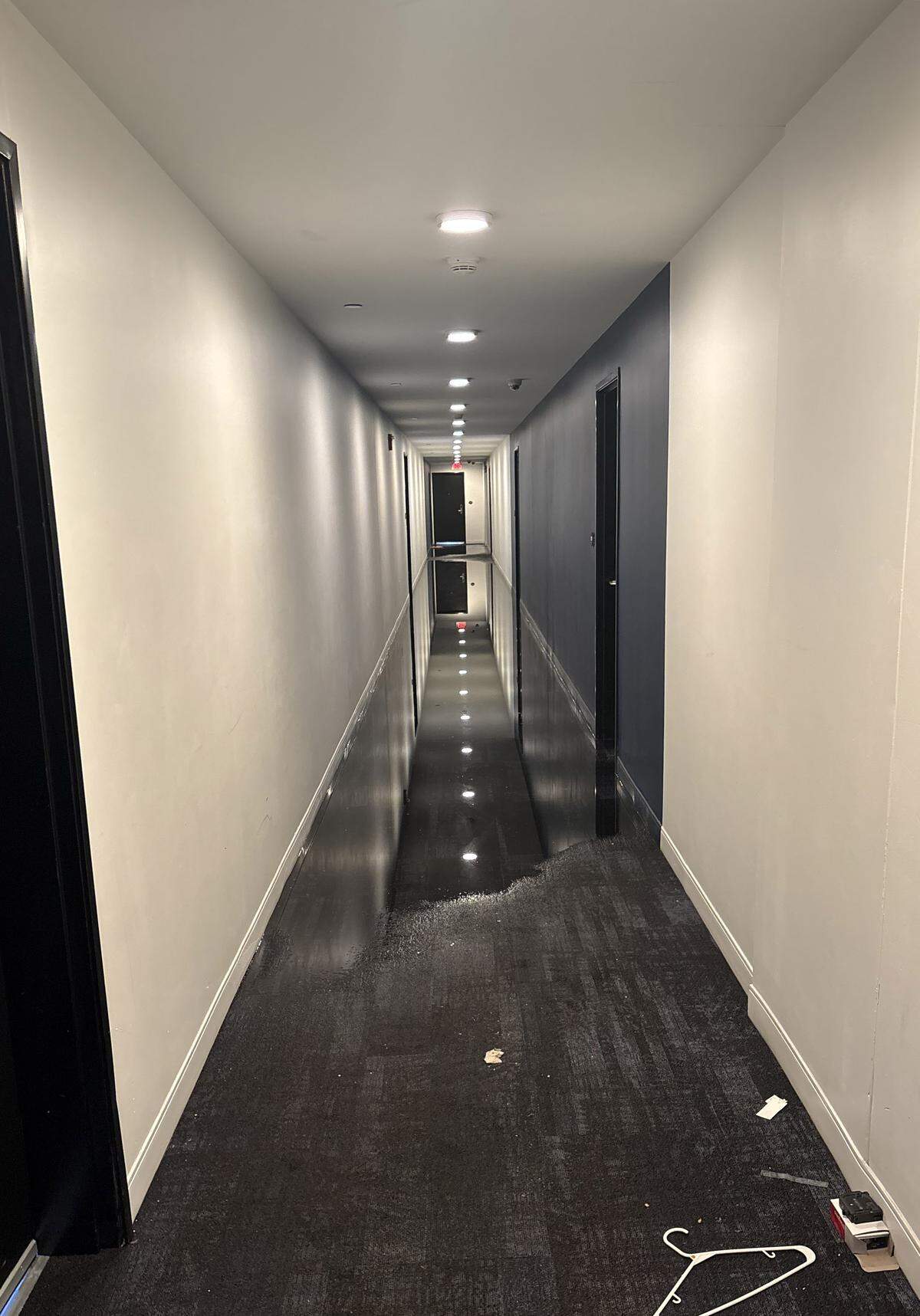  A hallway in The Maxxen, a high-rise apartment complex in downtown State College, was flooded on Feb. 2 after a pipe burst. Multiple Maxxen residents were forced out of their apartments and had to live in a hotel room for days, and in some cases, months. 