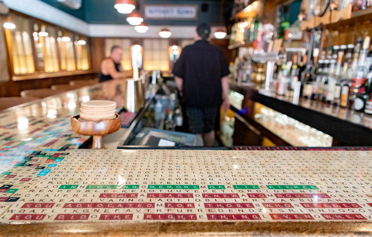 The bar top at Chumley’s has been done redone with Scrabble letters full of hidden words and messages, including one honoring original owner Liz Pierce.