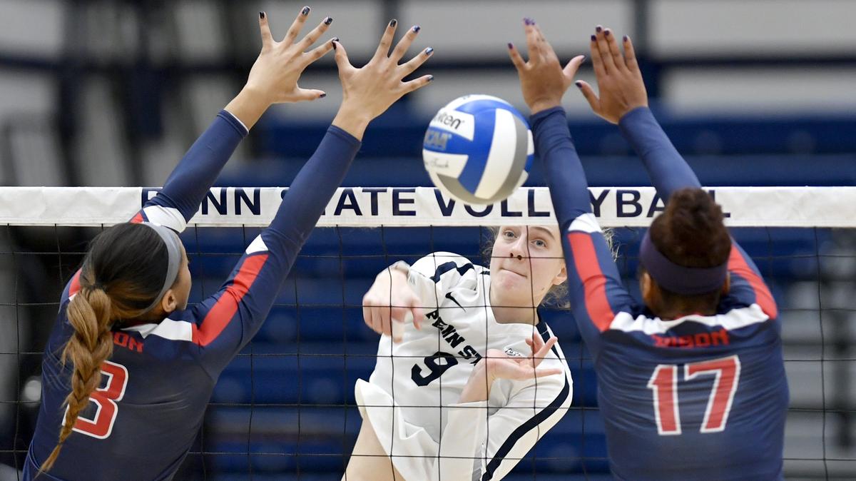 Penn State’s Jonni Parker gets the kill past Howard defenders during the first round of the NCAA tournament on Friday, Nov. 30, 2018 in Rec Hall.  Penn State won in three sets, 25-9, 25-9, 25-8.