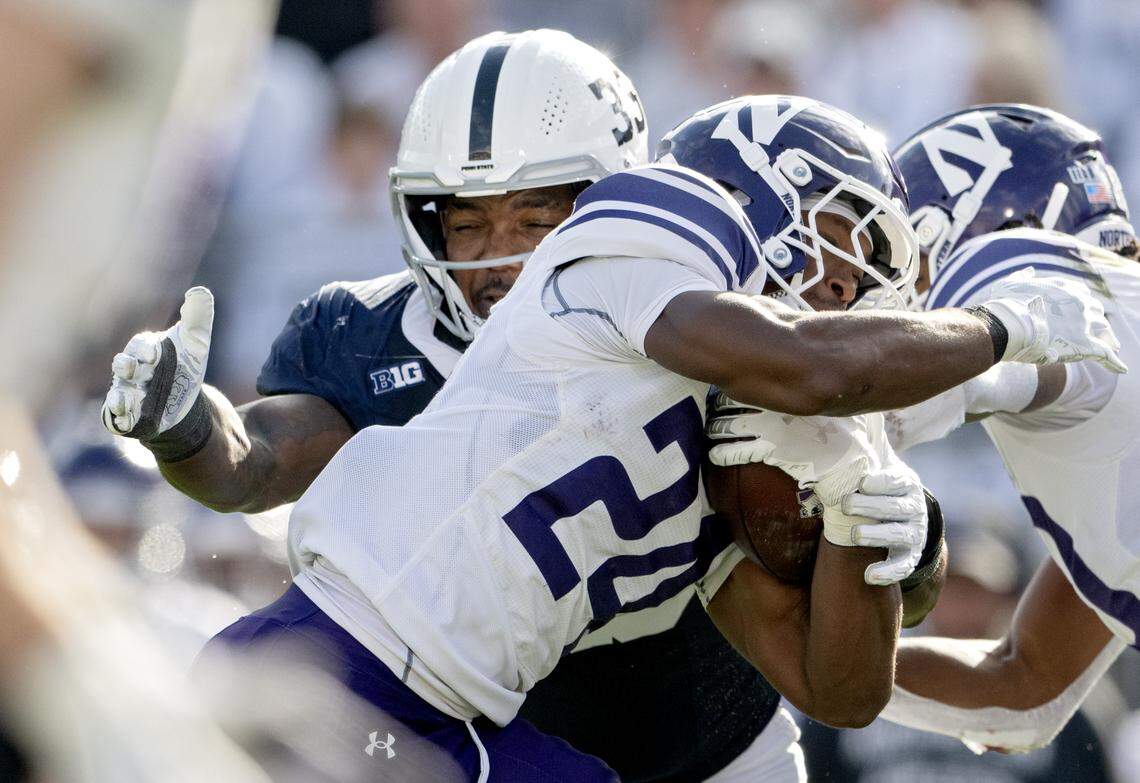 Penn State defensive end Dani Dennis-Sutton stops Northwestern’s Dashaun Reeder during the game on Saturday, Oct. 11, 2025.