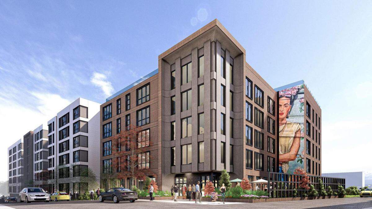A rendering of what Core Spaces hopes its proposed apartment building will look like at 240 S. Pugh St. The building would replace the Days Inn and other businesses, with construction expected to begin next September.