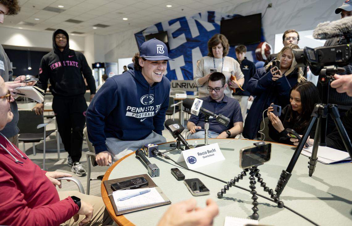 Penn State quarterback Rocco Becht laughs as he realizes the crowd at the table is there to talk to him during media availability on Wednesday, Feb. 25, 2026. 