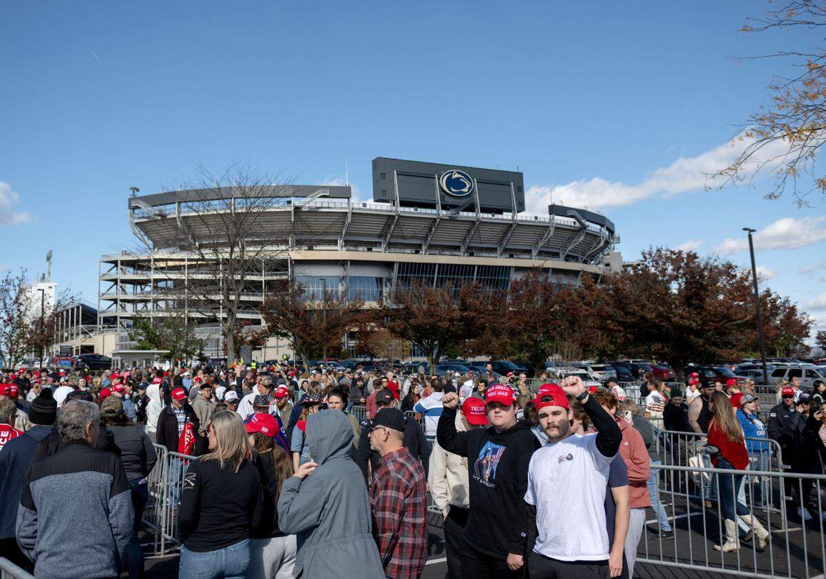 Trump supporters line up to enter the Bryce Jordan Center for a rally on Saturday, Oct. 26, 2024.