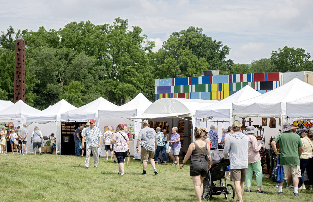 Visitors browse the booths at the People’s Choice Festival on the grounds of the Pennsylvania Military Museum in Boalsburg on Thursday, July 9, 2026.
