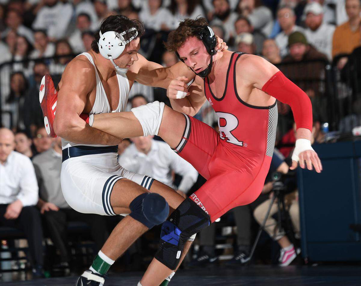 Penn State’s Shakur Rasheed (left) trips up Rutgers Jordan Pagano during the Jan. 19 match at Rec. Hall. Rasheed defeated Pagano, 6-0. Penn State defeated Rutgers 38-6.