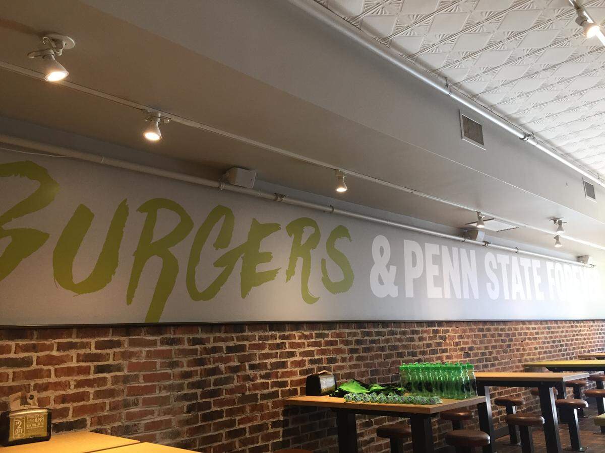 Decor inside Hello Bistro in State College says “Burgers and Penn State Forever,” in a nod to the local area.