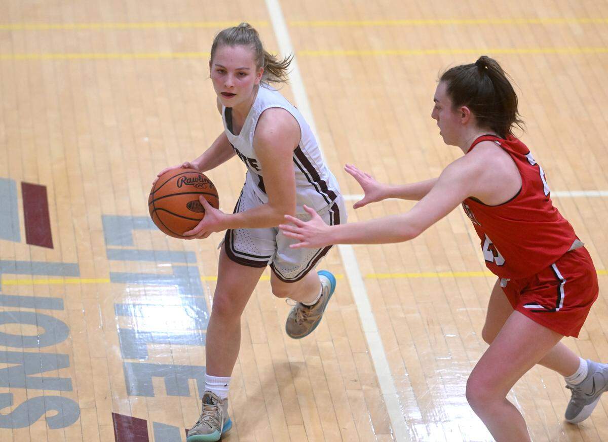 State College’s Jess Hawbaker dribbles around a Cumberland Valley defender during the game on Tuesday, Jan, 24, 2023.