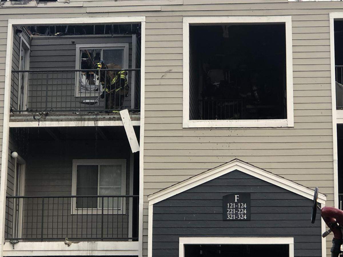 Alpha firefighters work on he scene of a third-alarm building fire at the Tremont Student Living complex in Patton Township on Sunday.