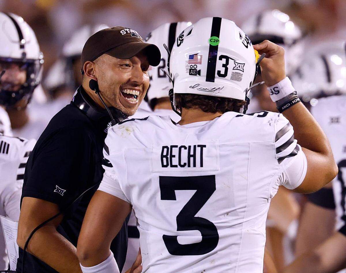 AMES, IA - SEPTEMBER 27: Head coach Matt Campbell of the Iowa State Cyclones celebates with quarterback Rocco Becht #3 of the Iowa State Cyclones after Becht scored a touchdown in the second half of play against the Arizona Wildcats at Jack Trice Stadium on September 27, 2025, in Ames, Iowa. The Iowa State Cyclones won 39-14 over the Arizona Wildcats. (Photo by David Purdy/Getty Images)