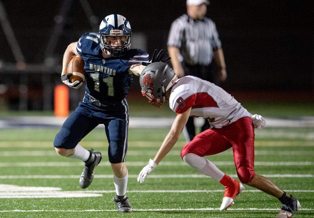 Philipsburg-Osceola’s Kaleb Stamm fights off CentralÕs Josh Biesinger as he runs down the field during the game on Friday, Sept. 25, 2020.