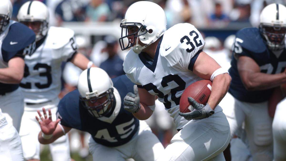 Mike Gasparato carries the ball during the Blue-White Game in 2004. Gasparato died Thursday of cancer at age 37.