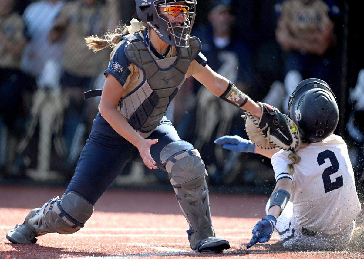 Bald Eagle’s Kailey Eckert tags out Penns Valley’s Taylor Bumgardner at the plate during the District 6 2A championship at Saint Francis on Thursday, June 1, 2023.