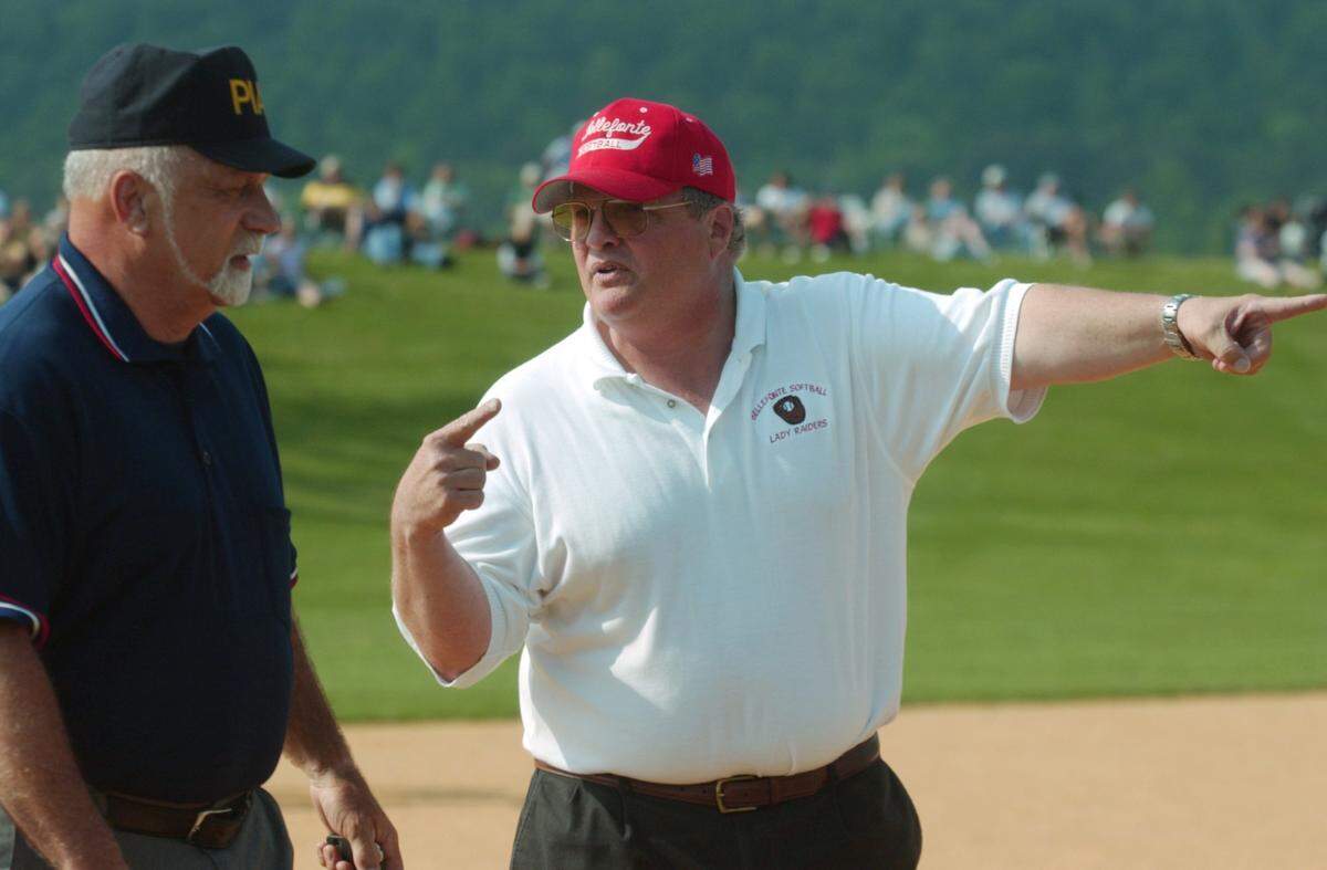 Bellefonte softball head coach John Wetzler argues a call with an umpire during a game against Bald Eagle Area on Monday, May 17, 2004.