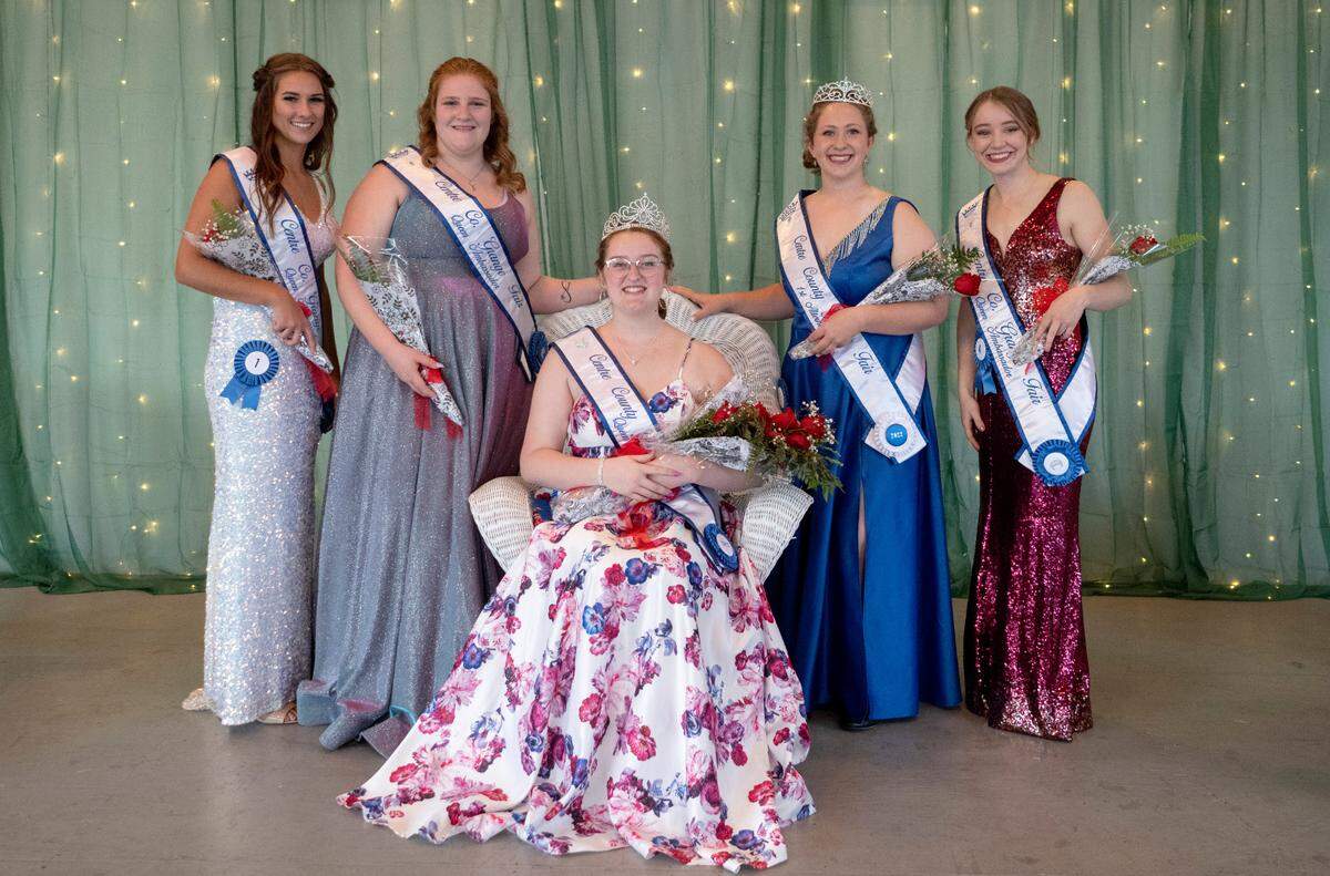 The 2022 Centre County Grange Fair Queen Ella Smith is surround by Grange Fair queen contestants Jocelyn Weaver, Hailey Lyn Ziegler, Remington Weaver and Makenzie Peters during the coronation on Wednesday, Aug. 17, 2022.
