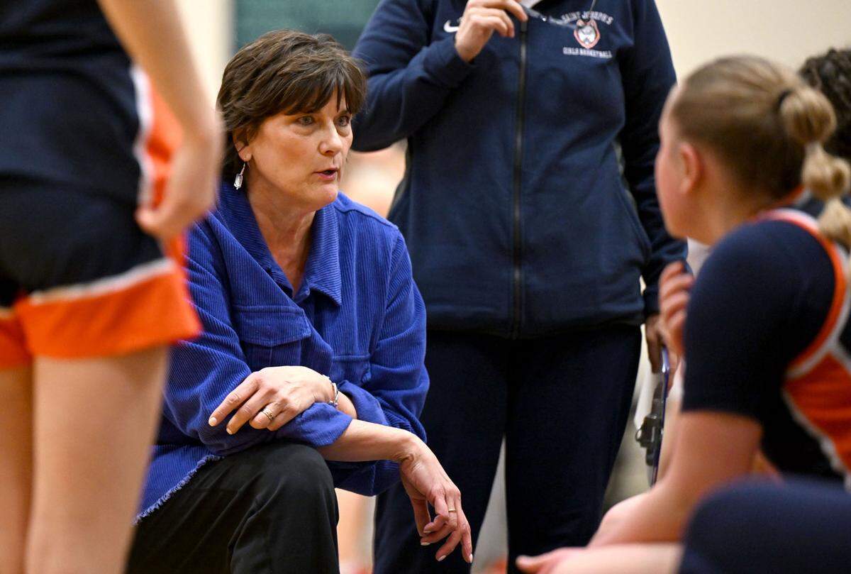 Saint Joseph’s Catholic Academy girls basketball coach Bethany Irwin talks to her players during a timeout of the game against DuBois Central Catholic on Wednesday, March, 12, 2025 at Bald Eagle Area High School.