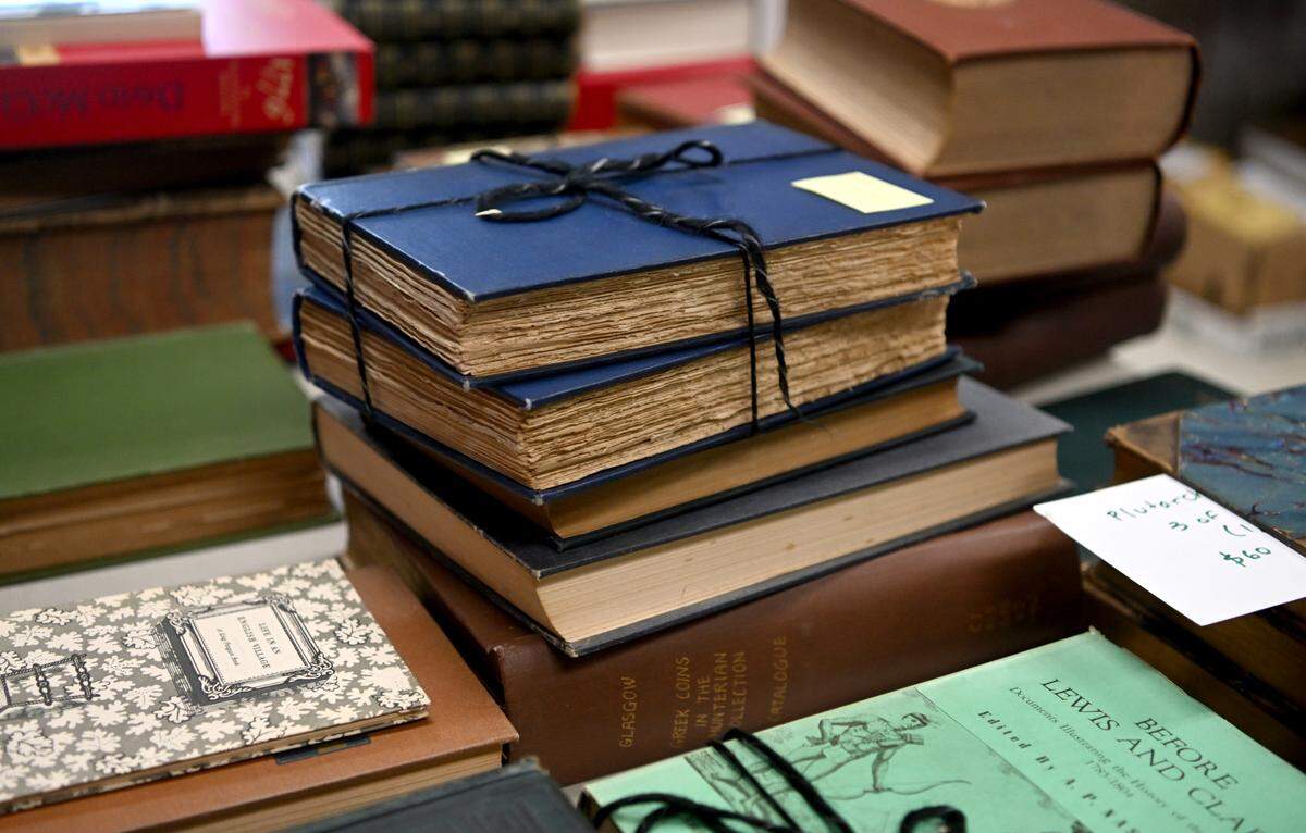 Some books in the special collections room for the AAUW used book sale at the Penn State Snider Agriculture Arena on May 11, 2023.