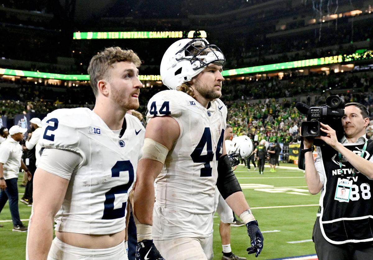 Penn State tight end Tyler Warren walks off the field in disappointment after falling to Oregon in the Big Ten Championship game at Lucas Oil Stadium on Saturday, Dec. 7, 2024.