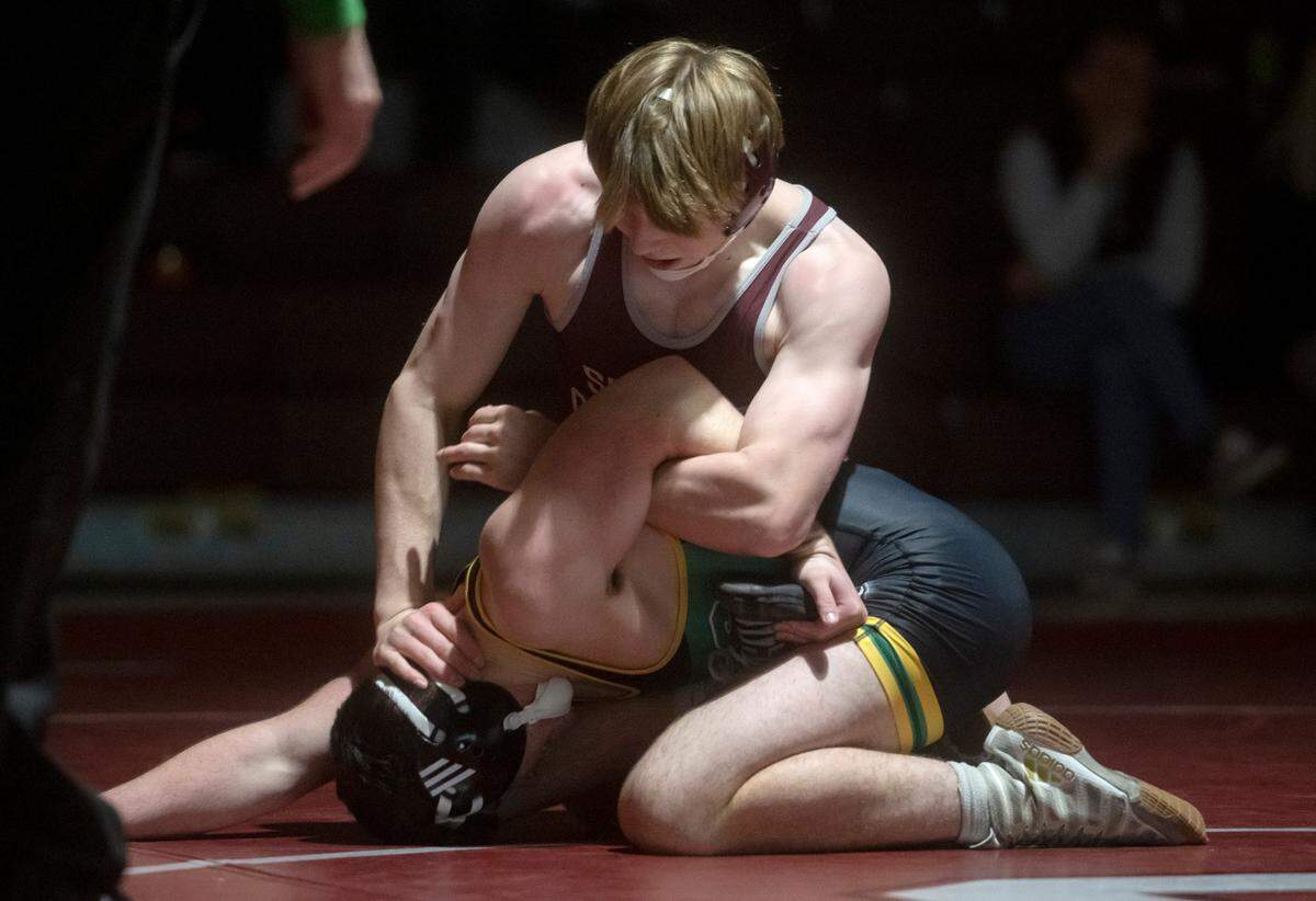 State College’s Asher Cunningham controls Central Dauphin’s Mike Beers in the 152 lb bout of the match on Wednesday, Dec. 14, 2022. Cunningham won by major decision, 9-1.