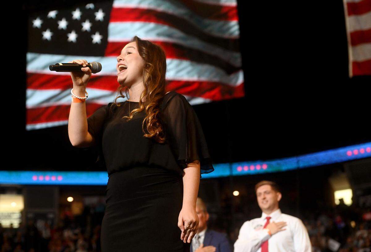 Ryan Brown sings the national Anthem at the start of the Donald Trump rally at the Bryce Jordan Center on Saturday, Oct. 26, 2024.