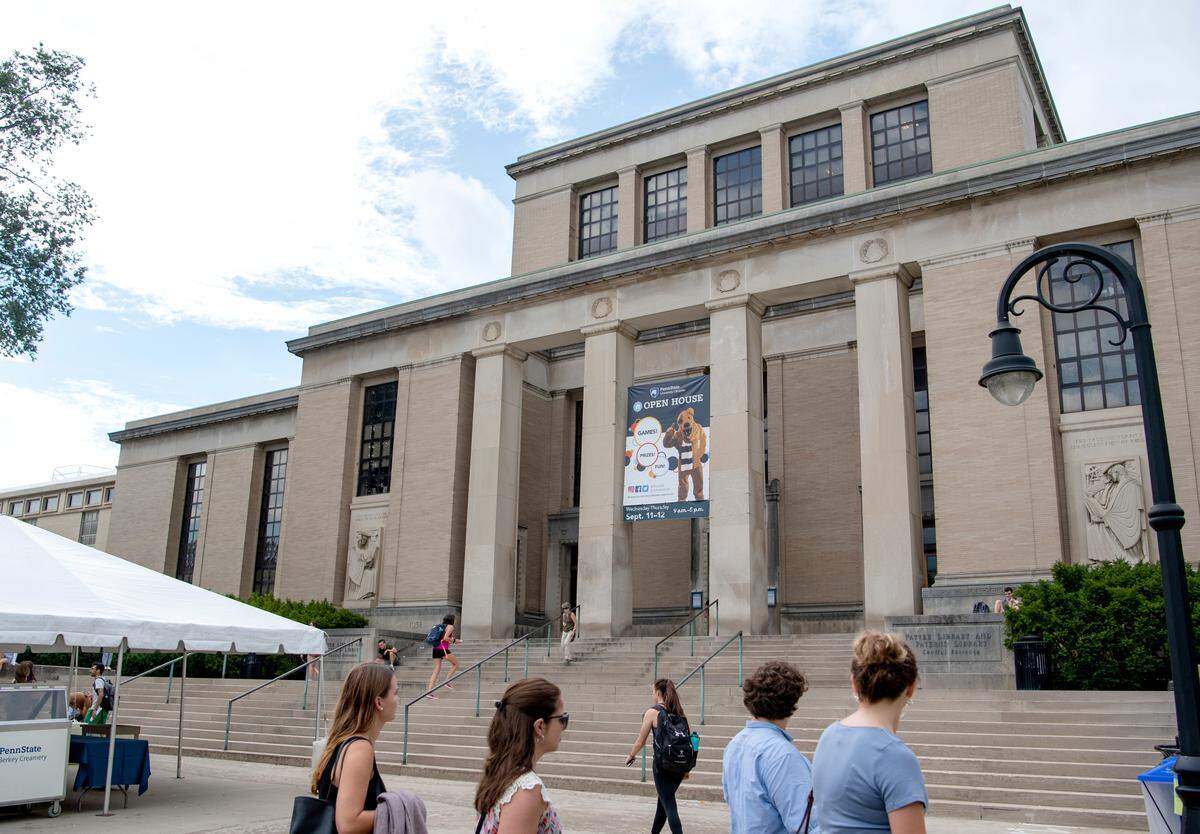Students visit the Penn State Library open house on the lawn of the library on Thursday, Sept. 12, 2019.